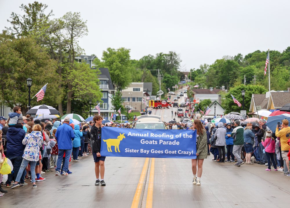 People at the Annual Roofing of the Goats Parade and Festival