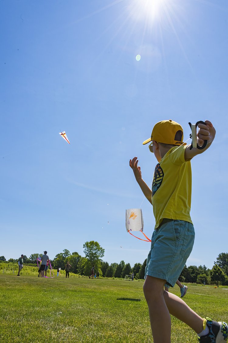 kid flying a kite in Sister Bay