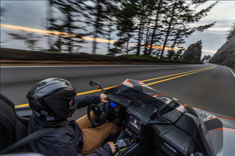 person driving slingshot vehicle