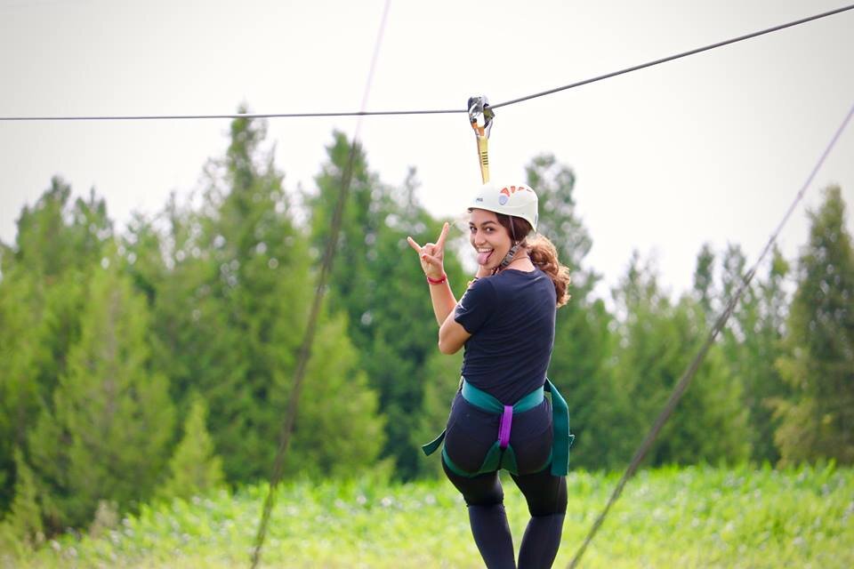 woman ziplining at Door County Adventure Center