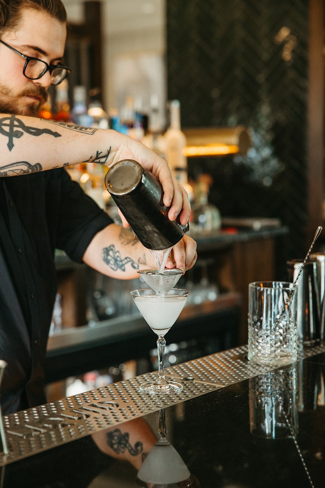 man making a mixed drink