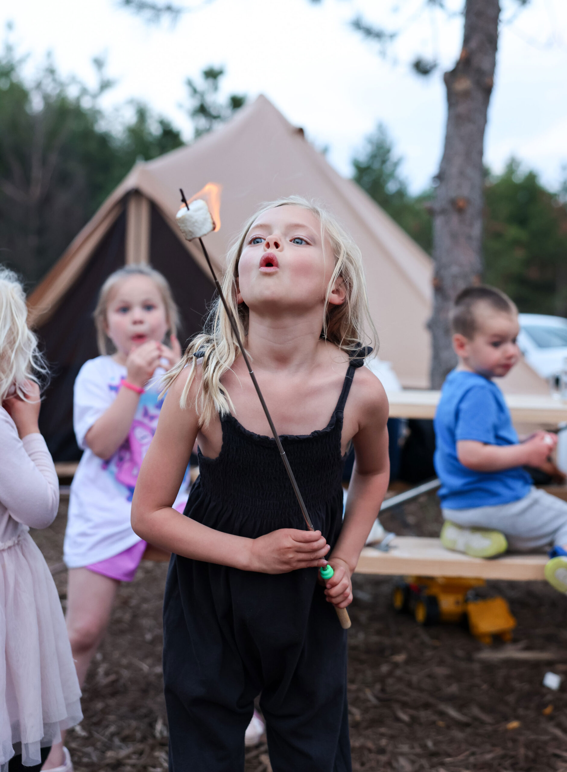 Girl making s'mores at Camp Door County