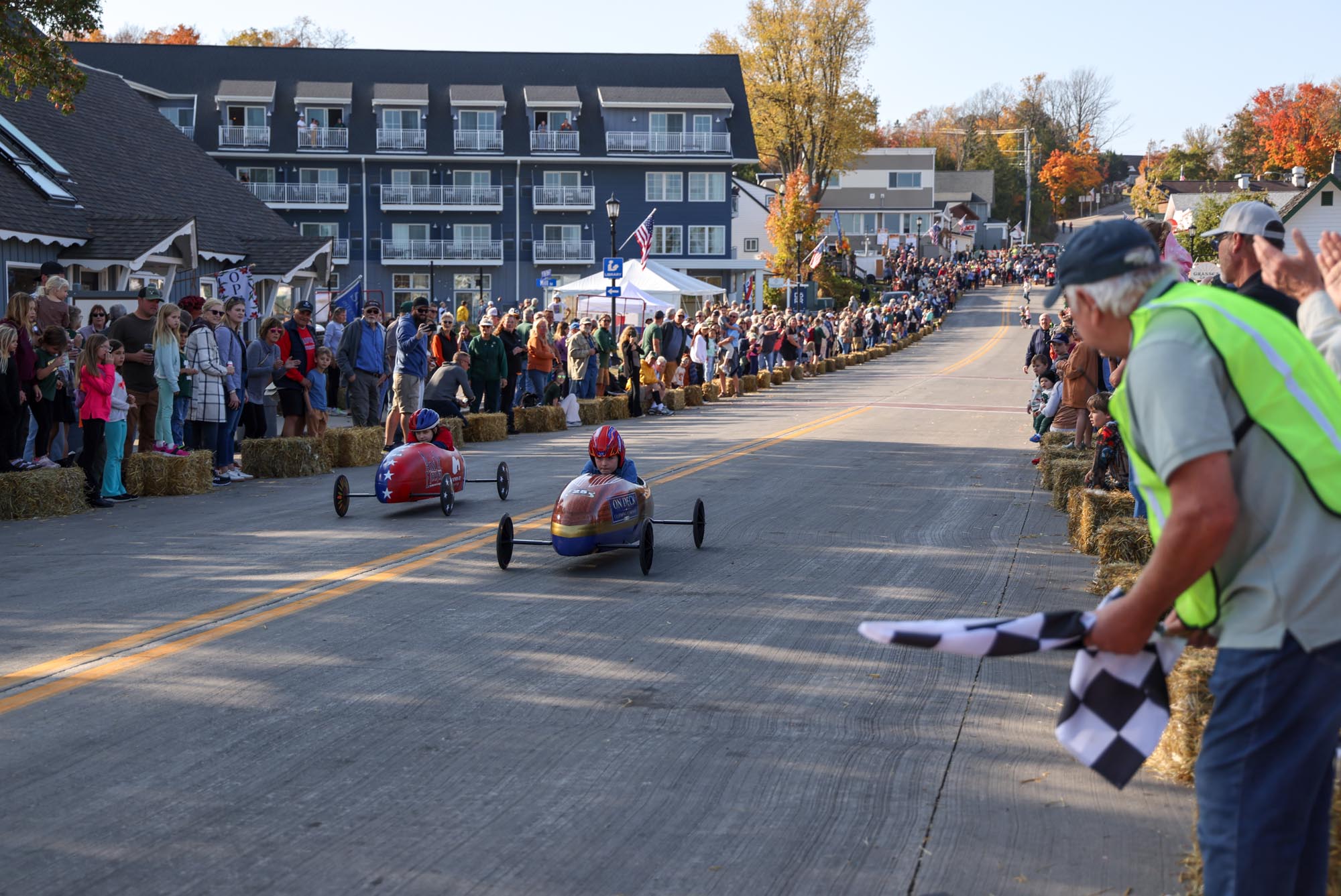 two soap box cars coming close to the finish line