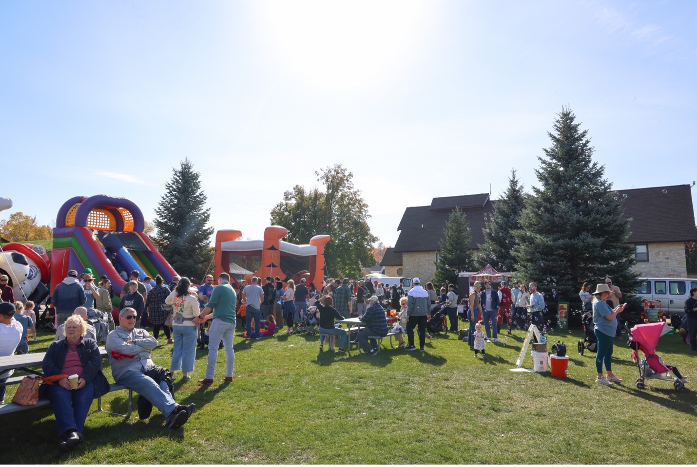 Family fun area with bouhnce houses at Fall Festival