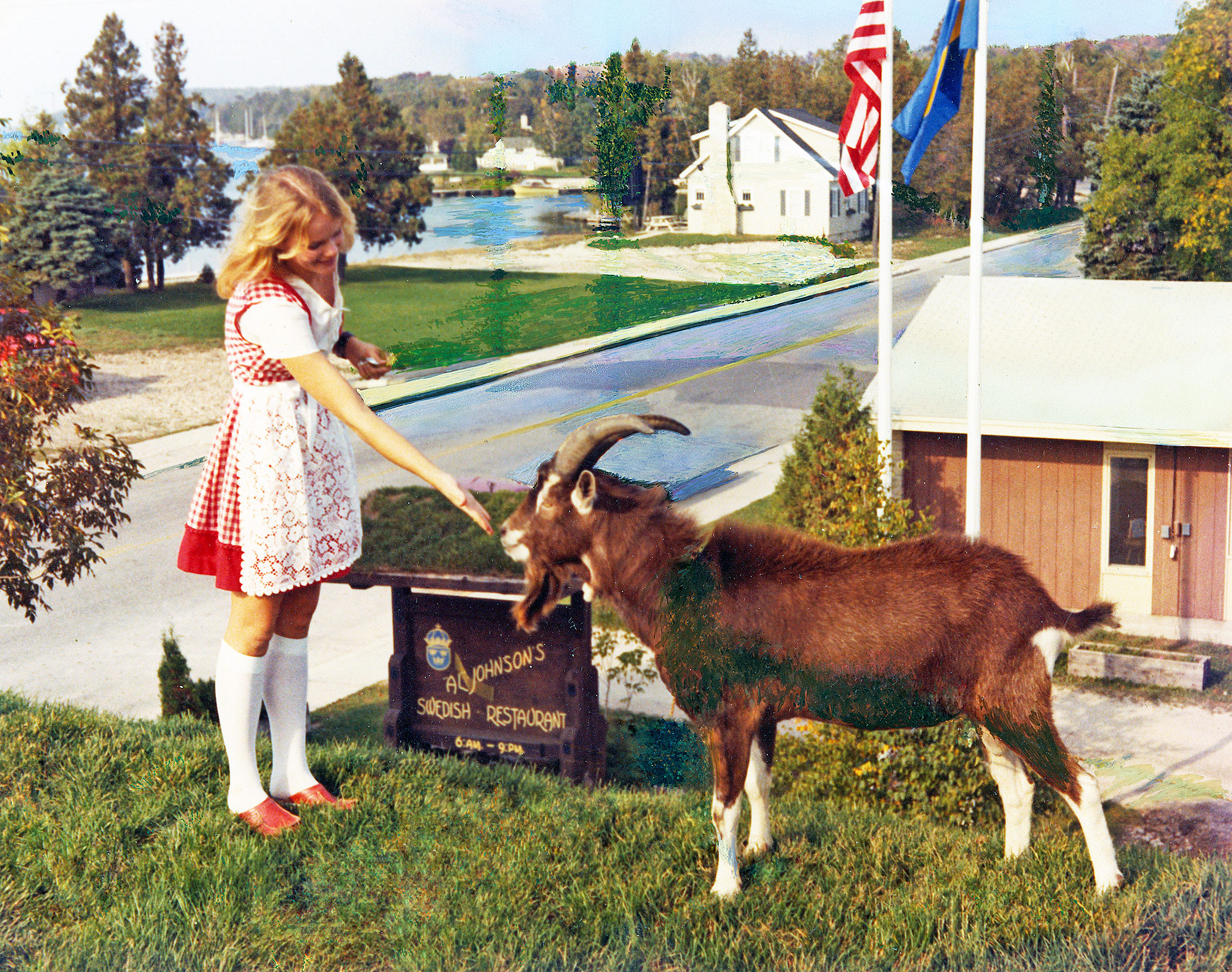 A girl and goat on the roof of Al Johnson's