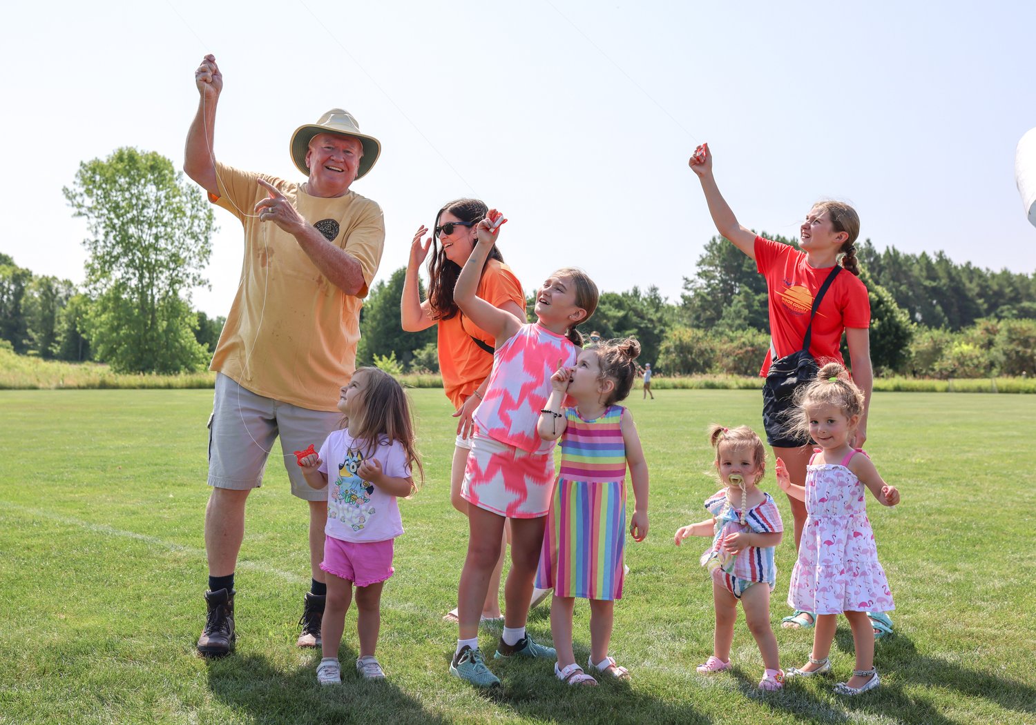 Family flying a kite in Sister Bay