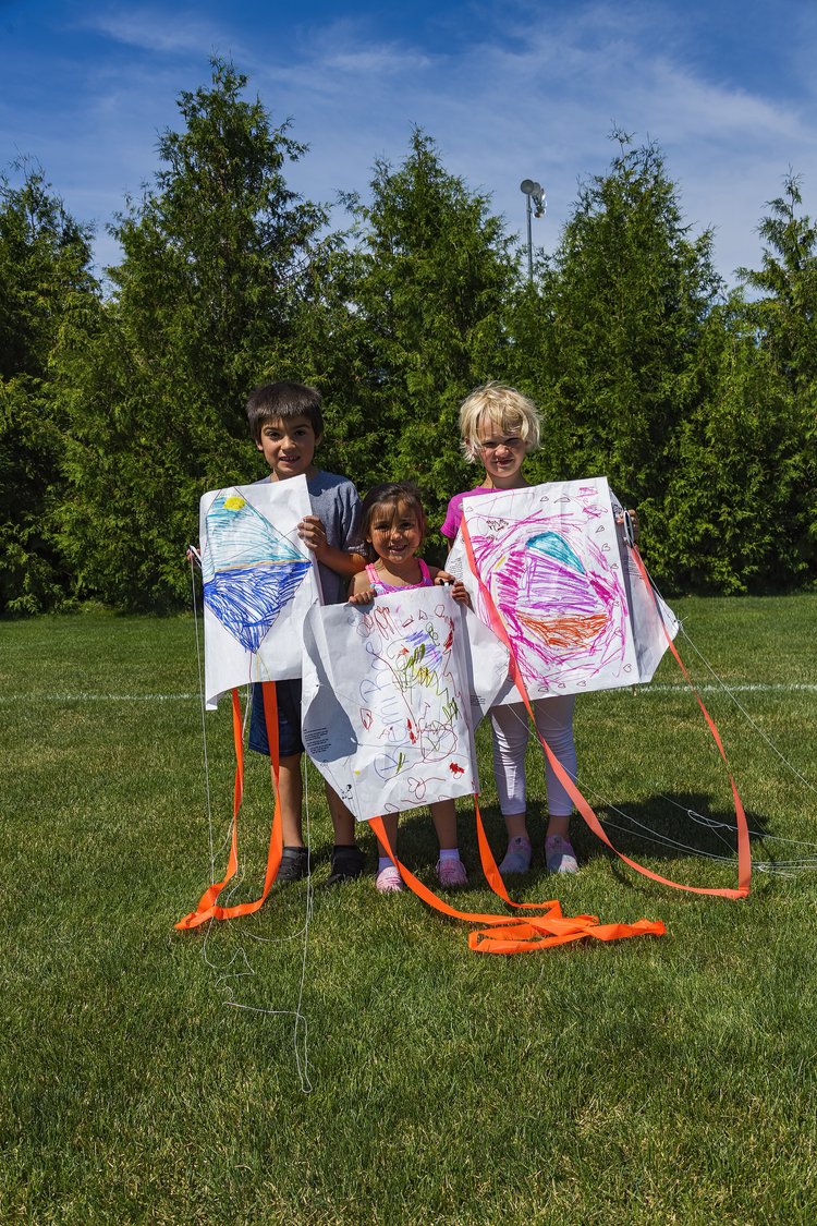 Kids showing off their kites at Kite Day in Sister Bay