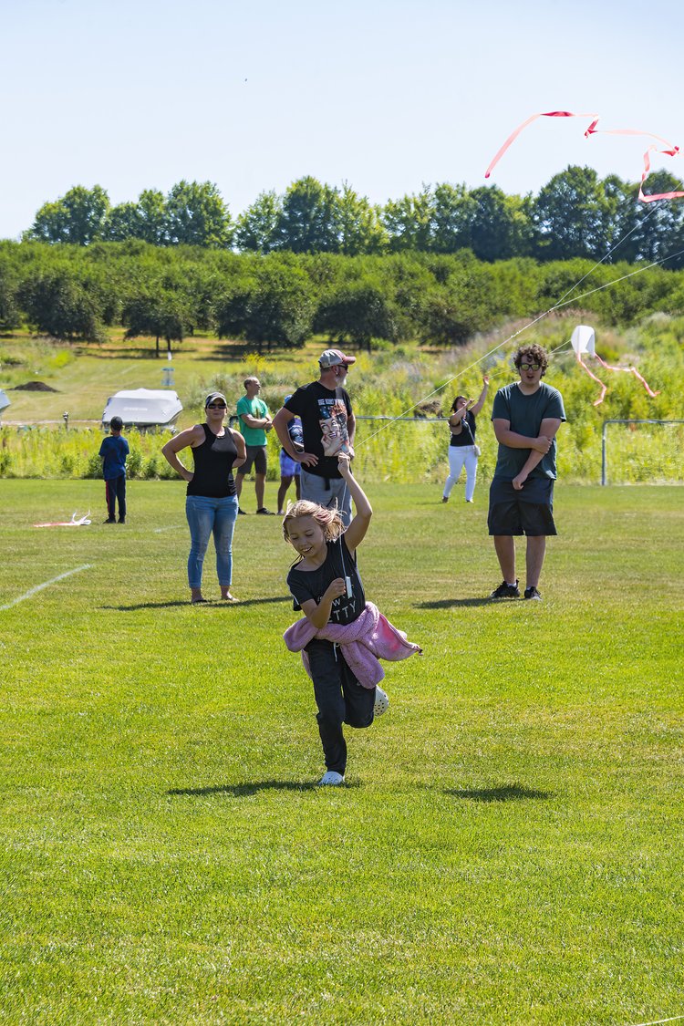 kid flying a kite in Sister Bay