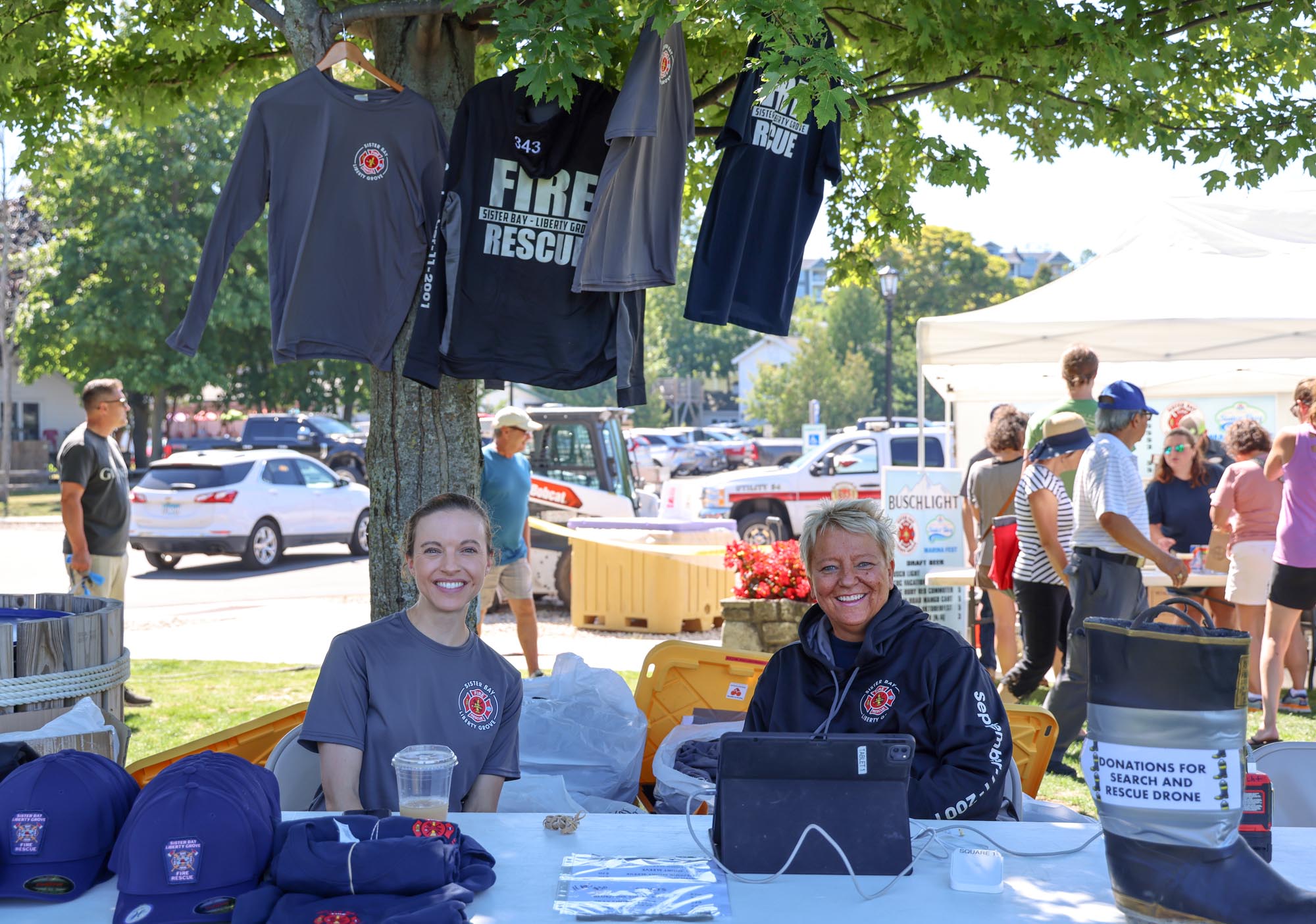 Two vendors smiling