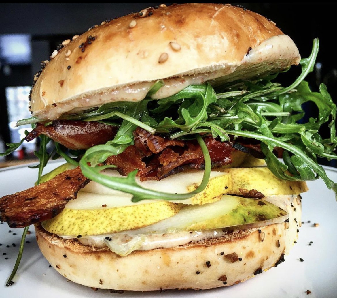 Burger with a lot of toppings from Roots Inn and Kitchen in Sister Bay