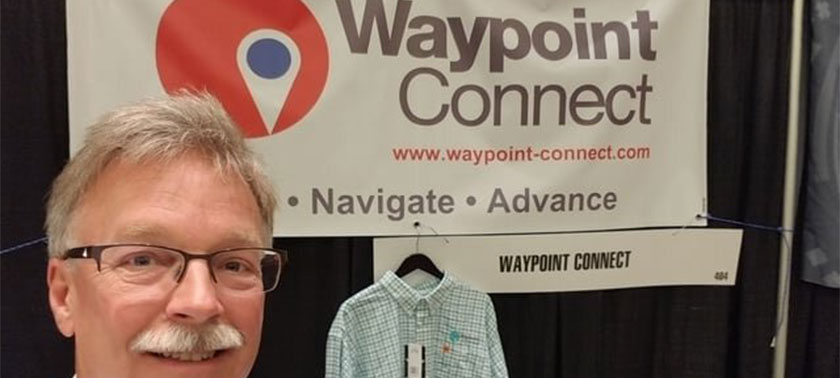 man in front of Waypoint Connect banner