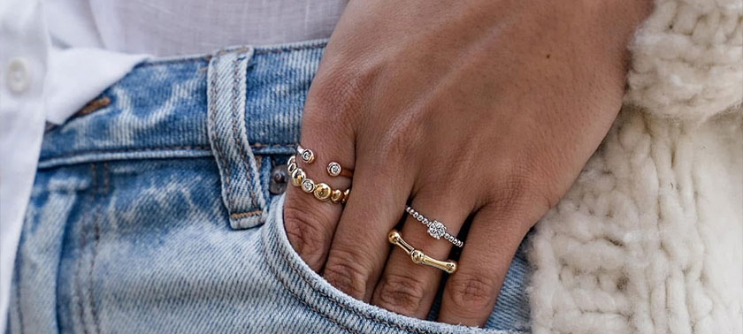 Hand with four rings from Trilliant in Sister Bay