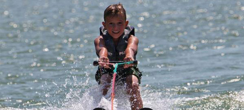 boy water skiing