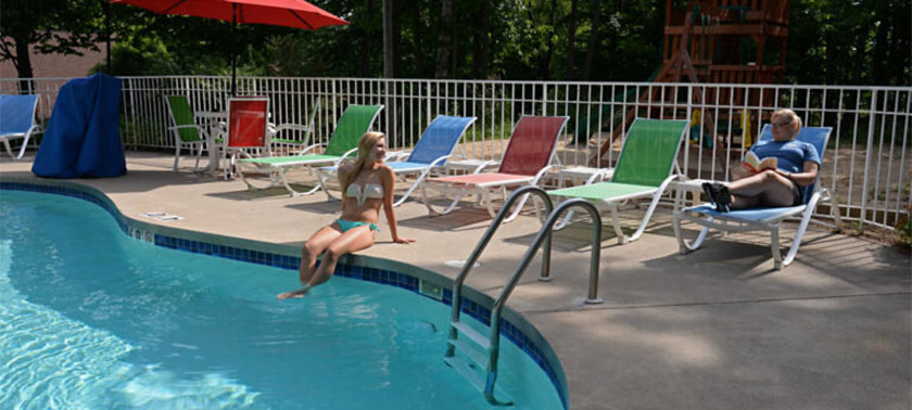 girl sitting at outdoor pool at The Inn at Little Sister Hill