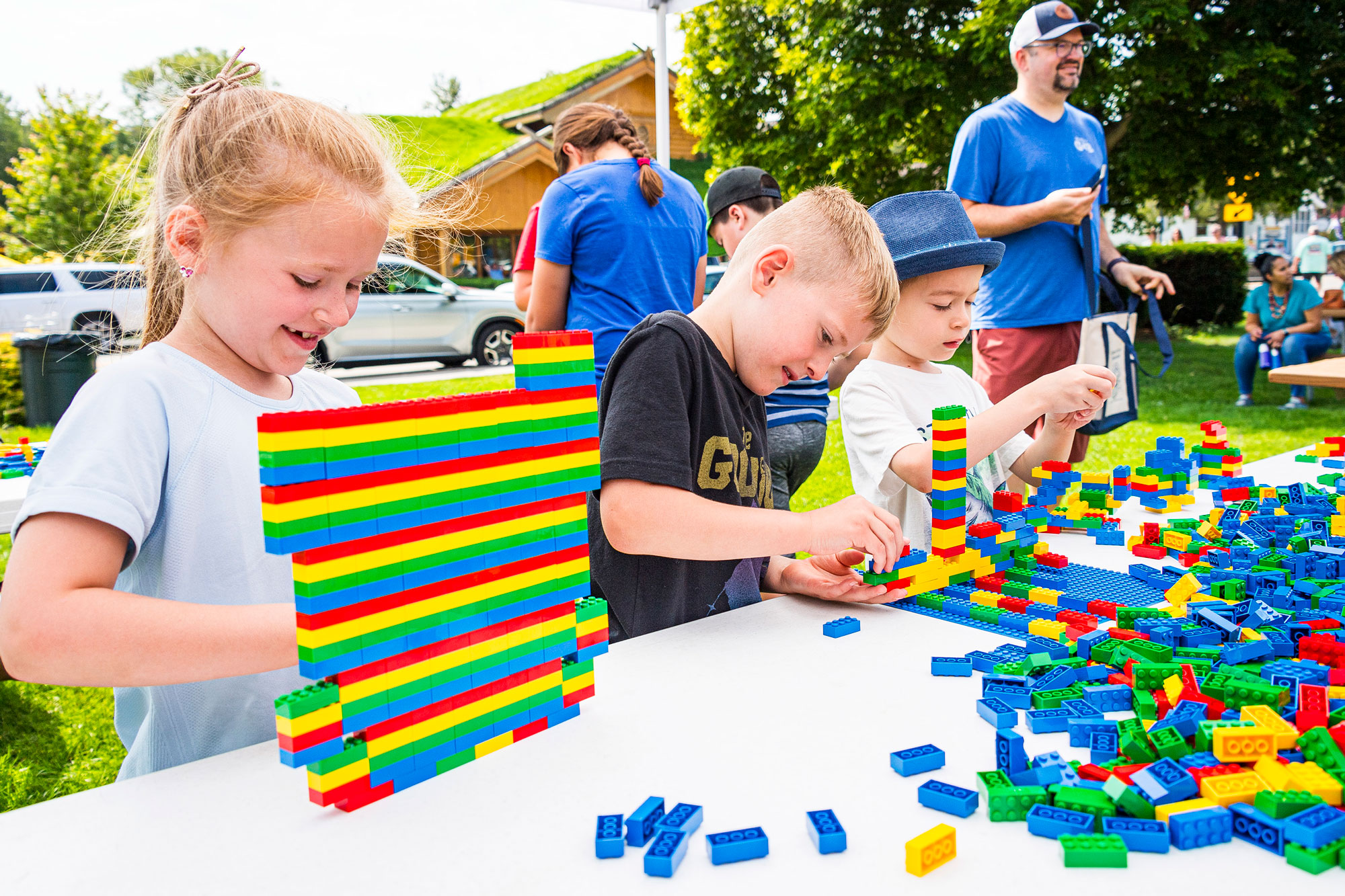 Two kids building with bricks during brick party in sister bay