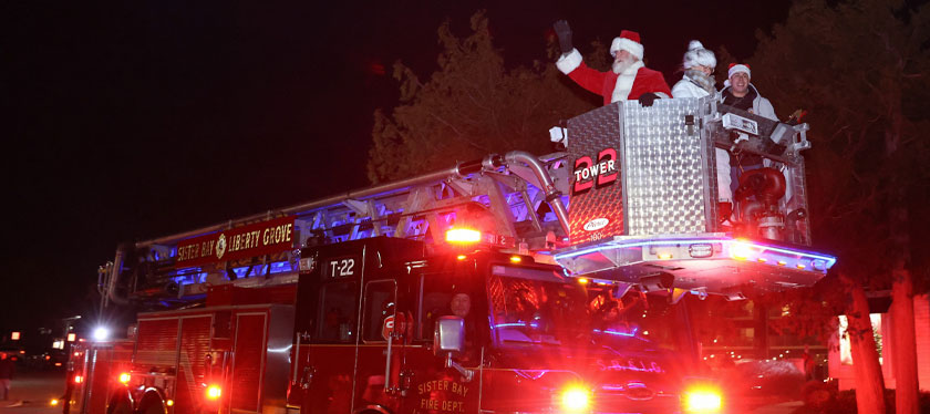 Santa riding on a firetruck