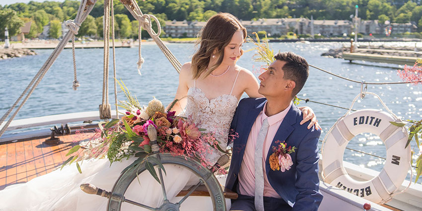 SisterBay-Website-Wedding-1-850x425_041025 Bride and groom on a boat in Sister Bay