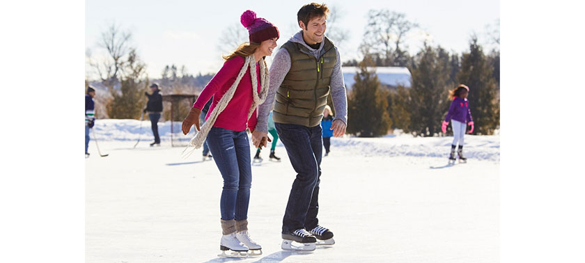 couple skating in ice rink