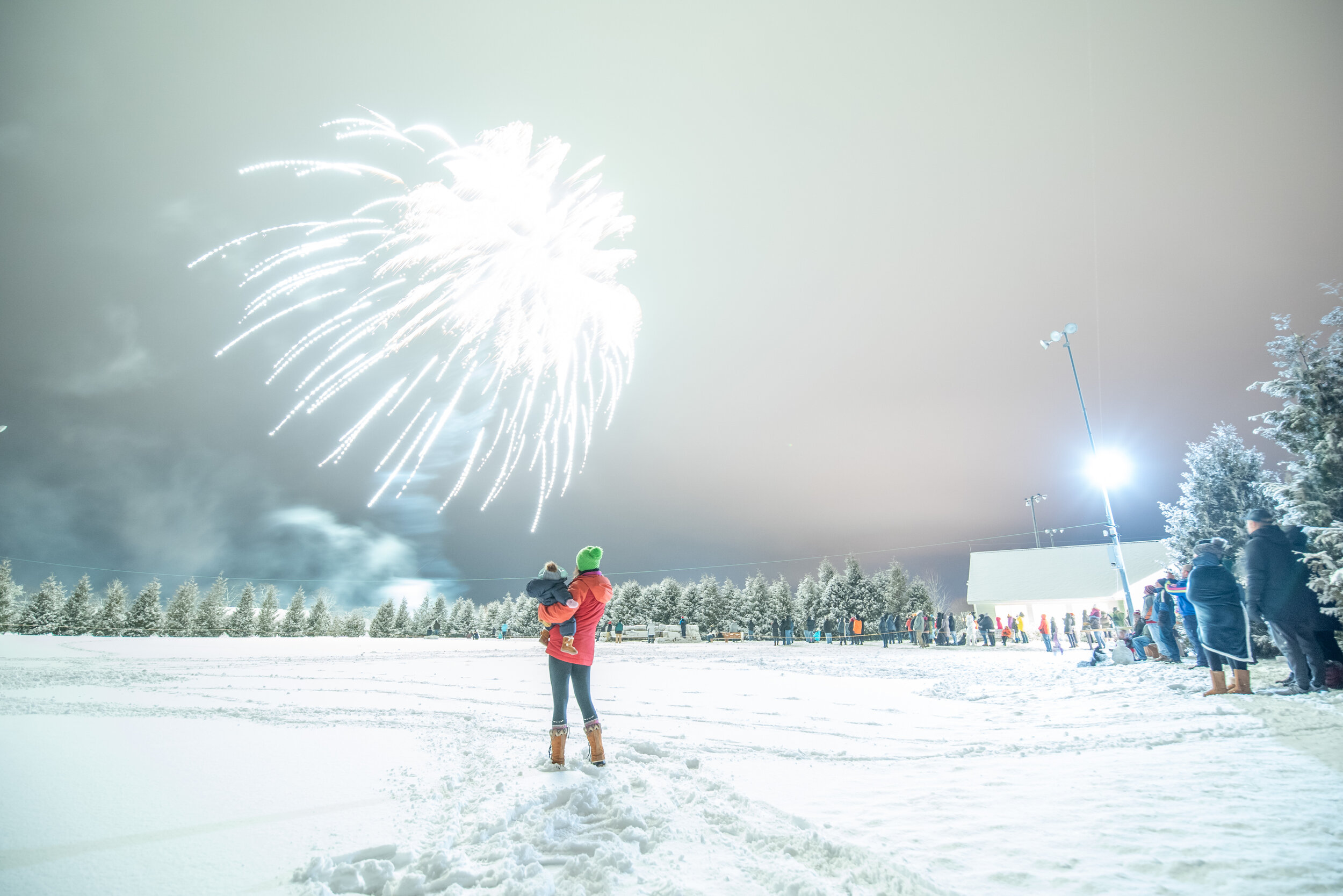 woman and child watching fireworks