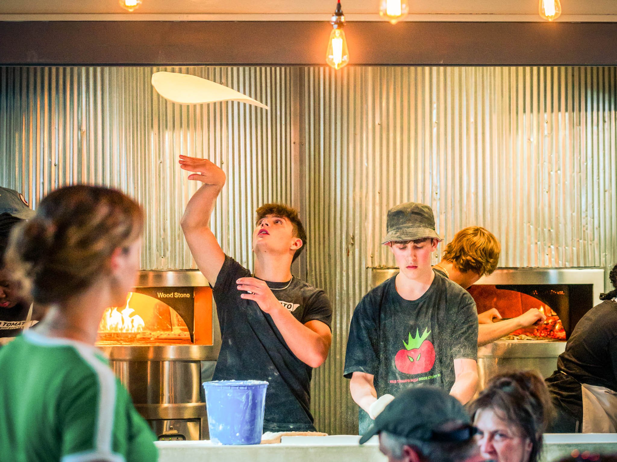 people making pizza