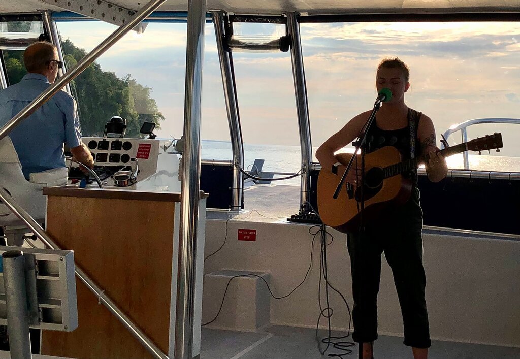 young musician on a boat tour