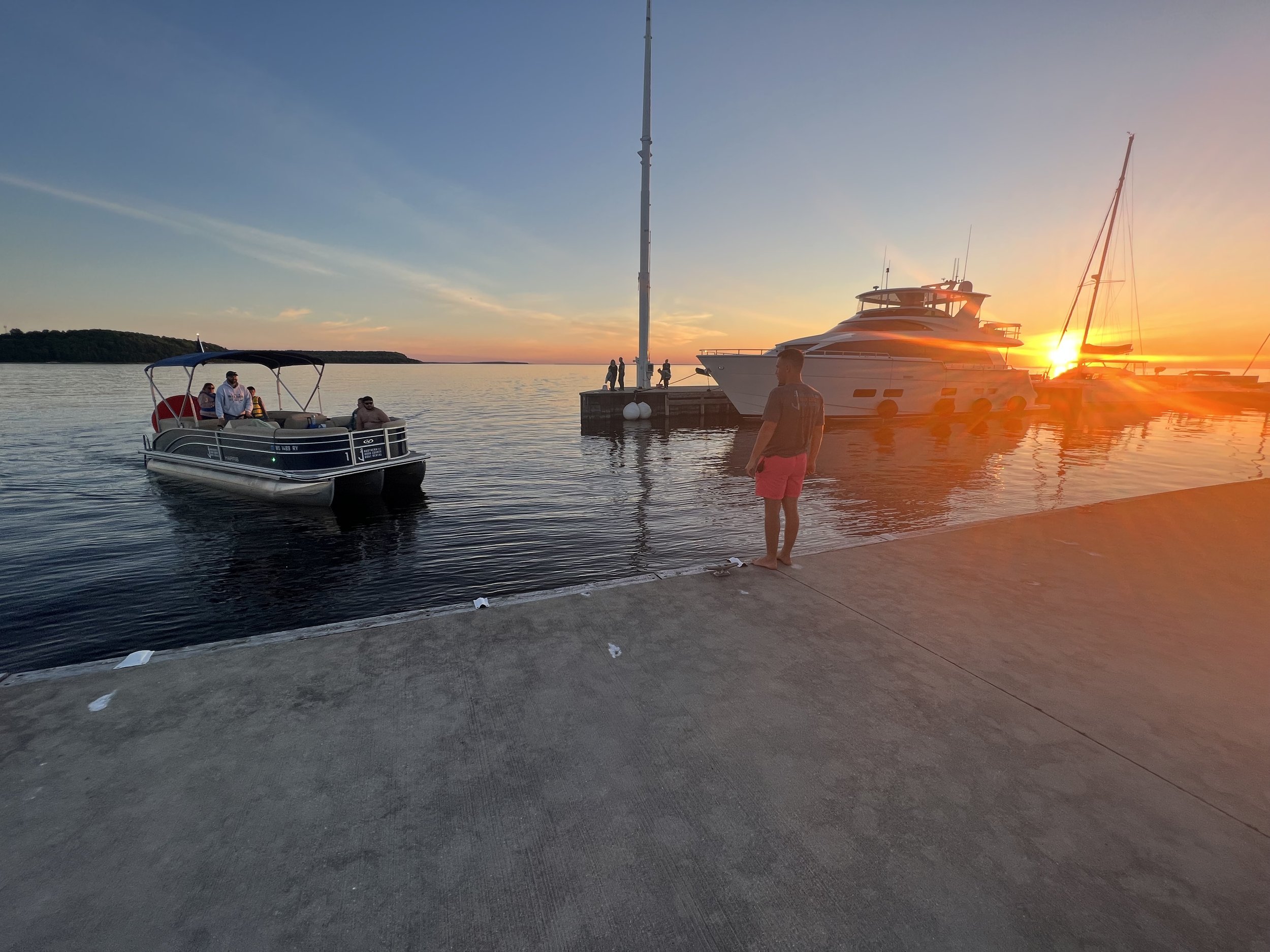 boats on the water at sunset